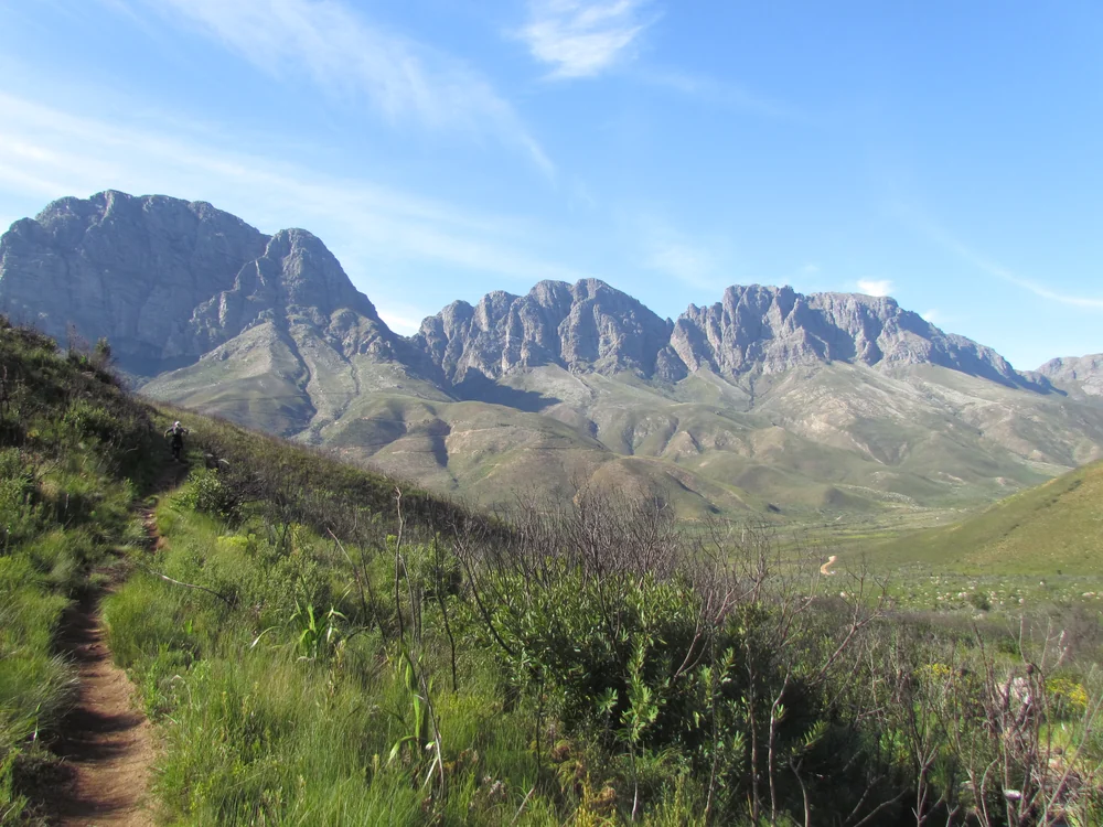 A hiking trail below the rocky mountain peaks of Jonkershoek Nature Reserve near Stellenbosch