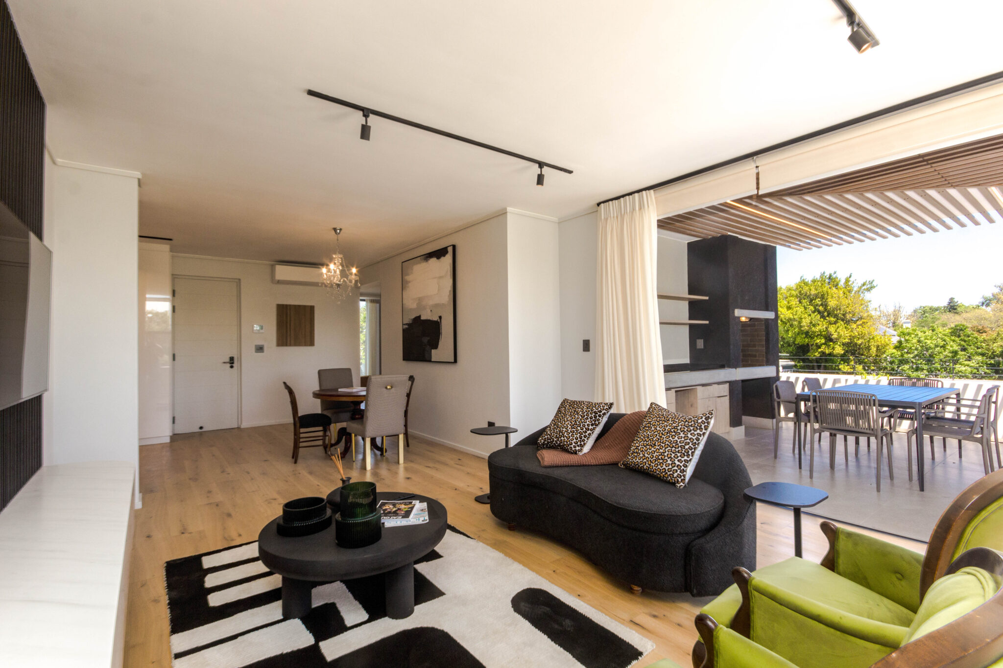 Penthouse lounge, dining space and elevated balcony at Aan de Meul