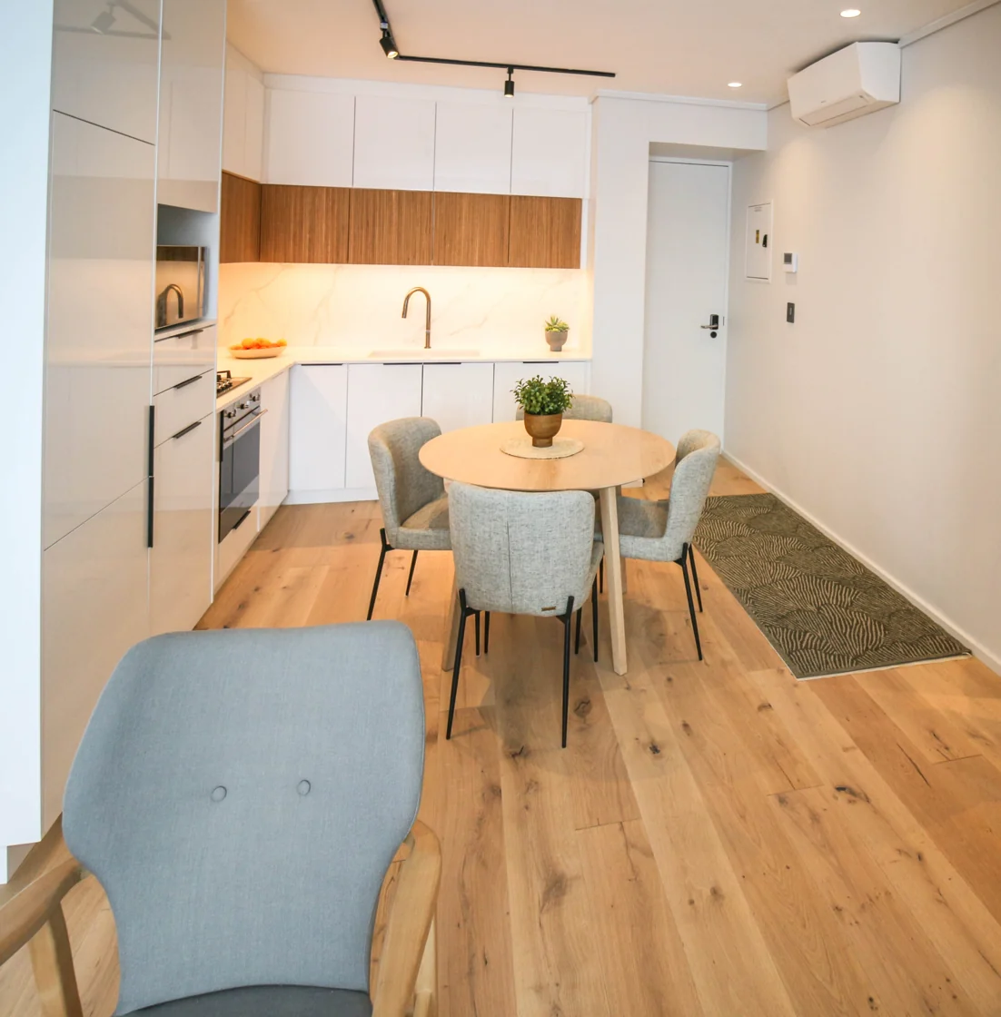 Open-plan dining space beside the equipped kitchen in the Luxury Two Bedroom apartment at Aan de Meul